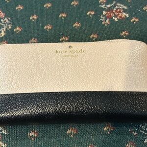 Kate Spade, beige and black wallet with outside compartment 7 1/2 x 4 by one